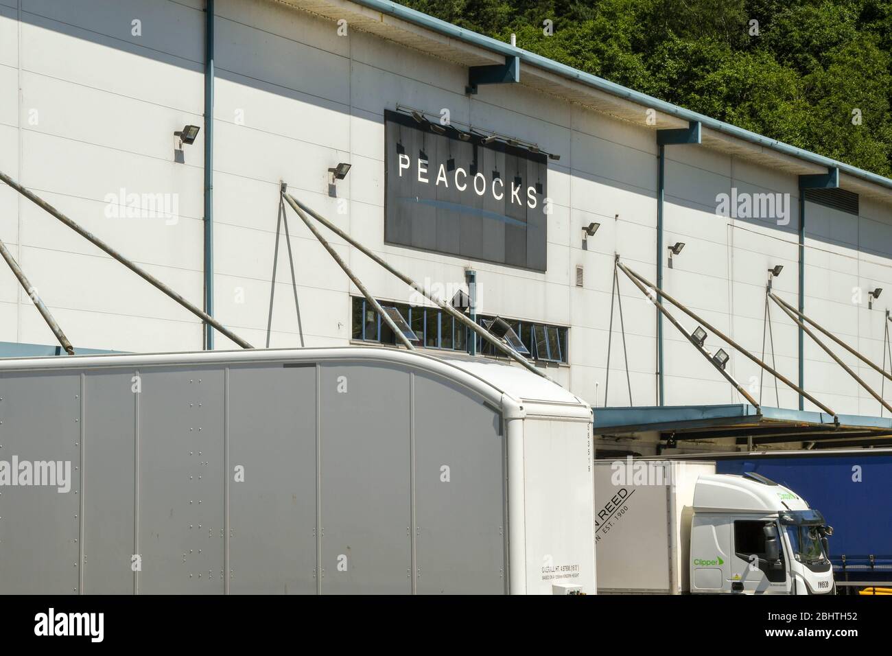 NANTGARW, NEAR CARDIFF, WALES - JUNE 2018: Landscape view of trailers outside a Peacocks distribution centre at Nantgarw, near the M4 north of Cardiff Stock Photo