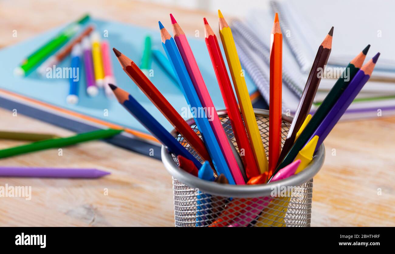 Colored pencils kept in pencil holder Stock Photo
