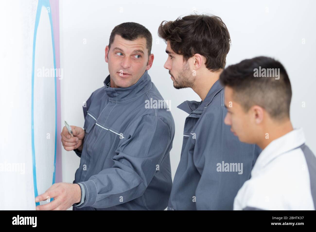 young apprentice painter in professional training Stock Photo