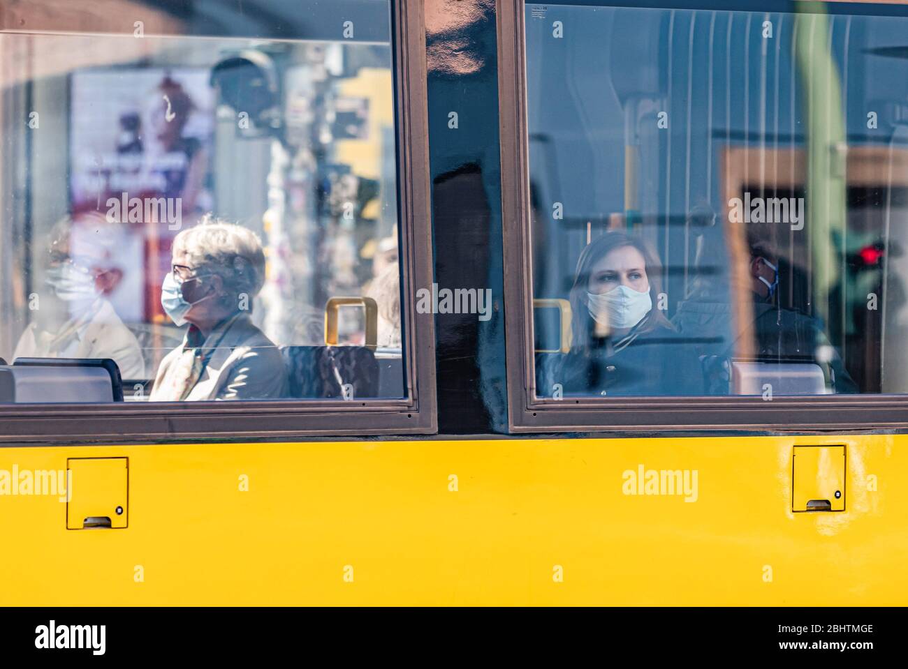 Berlin, Germany. 27th Apr, 2020. Passengers wearing face masks are seen on a tram in Berlin, capital of Germany, April 27, 2020. In most German states, face masks or an equivalent mouth-and-nose cover have become mandatory on Monday when people travel by bus or train or go for shopping. The rate of new COVID-19 infections in Germany continued below peak times as the number of confirmed cases increased by 1,018 within one day to 155,193, the Robert Koch Institute (RKI) announced on Monday. Credit: Binh Truong/Xinhua/Alamy Live News Stock Photo