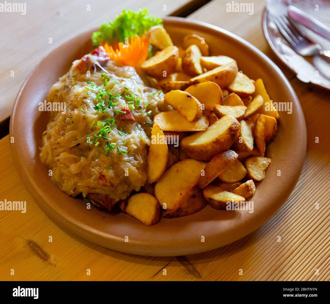 Traditional Polish stew of pork ribs and sauerkraut with side dish of