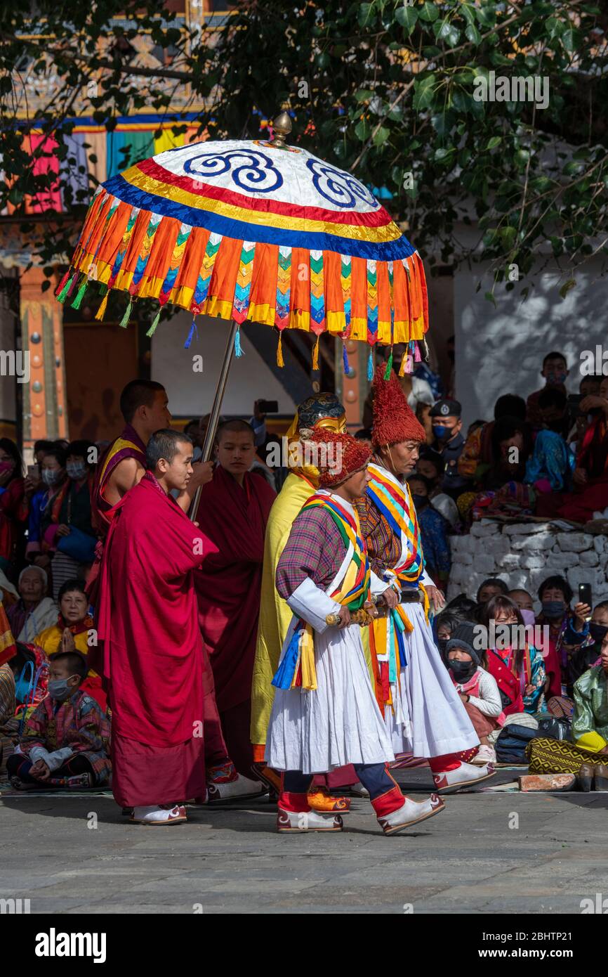 Bhutan, Punakha Dzong. Punakha Drubchen Festival. Local performers in traditional attire. Stock Photo
