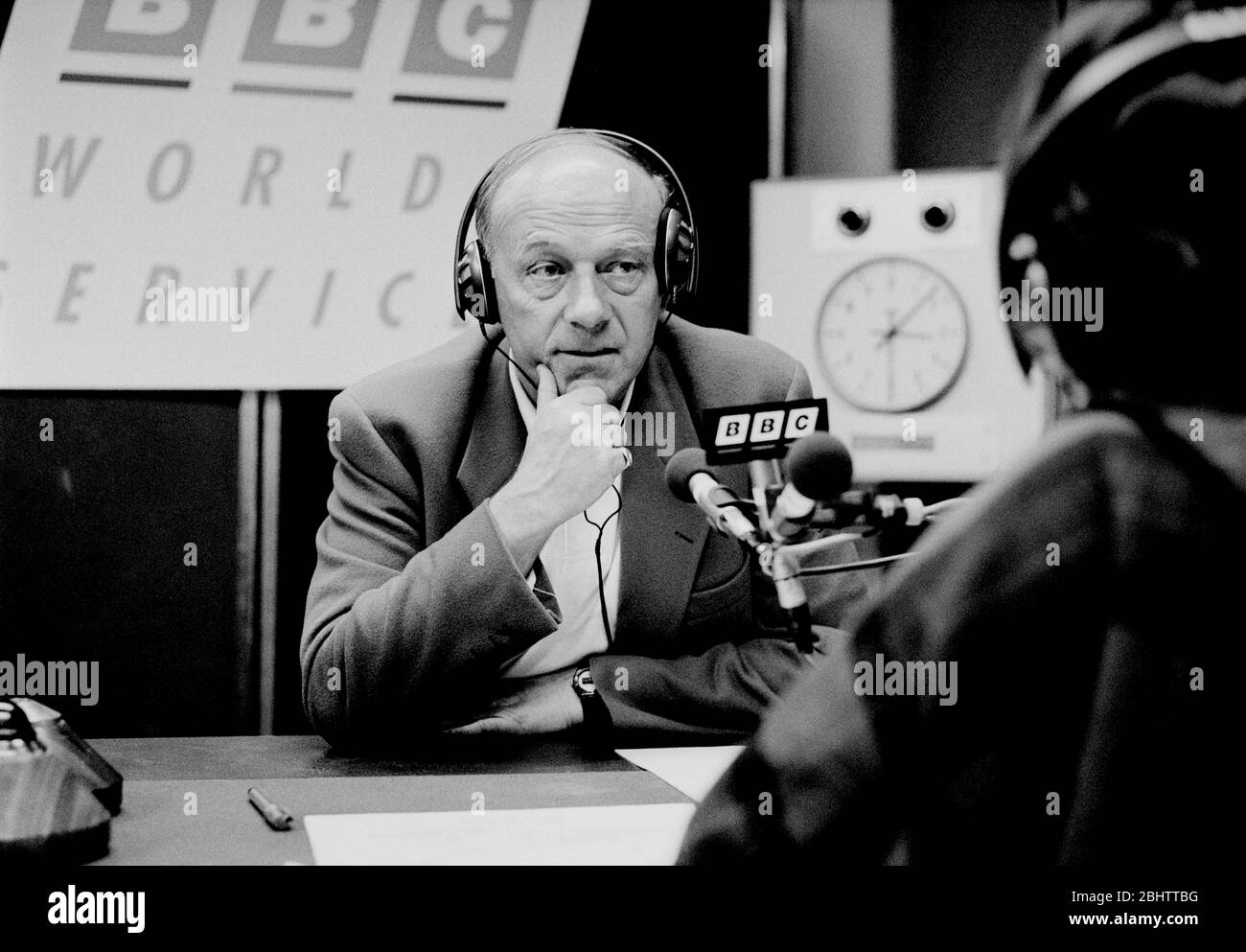 John Tusa during a radio interview at the BBC World Service, London, UK Stock Photo