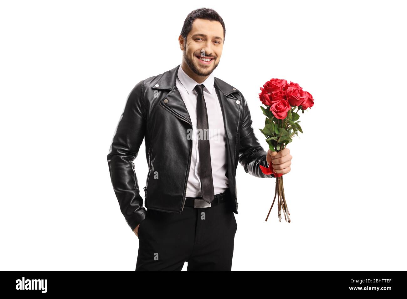 Handsome man in a leather jacket holding a bunch of roses isolated on white background Stock Photo