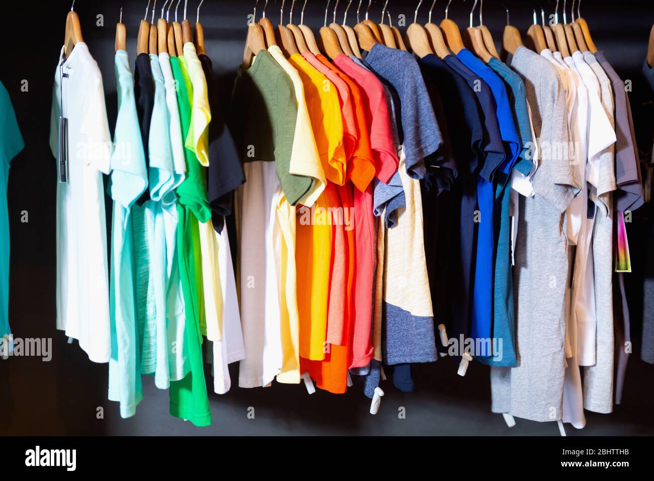 Interior of fashion modern stylish male clothing store with clothes on
