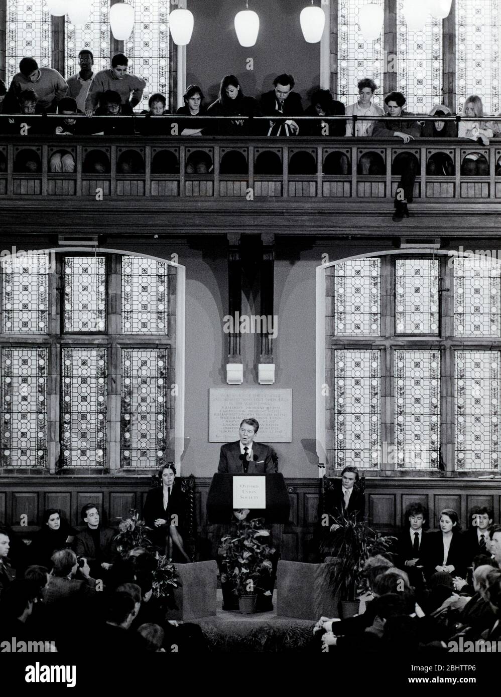 Former President of the USA Ronald Reagan speaks at the Oxford Union Society. Behind him is Chris Hall, president of the Oxford Union Society. Stock Photo