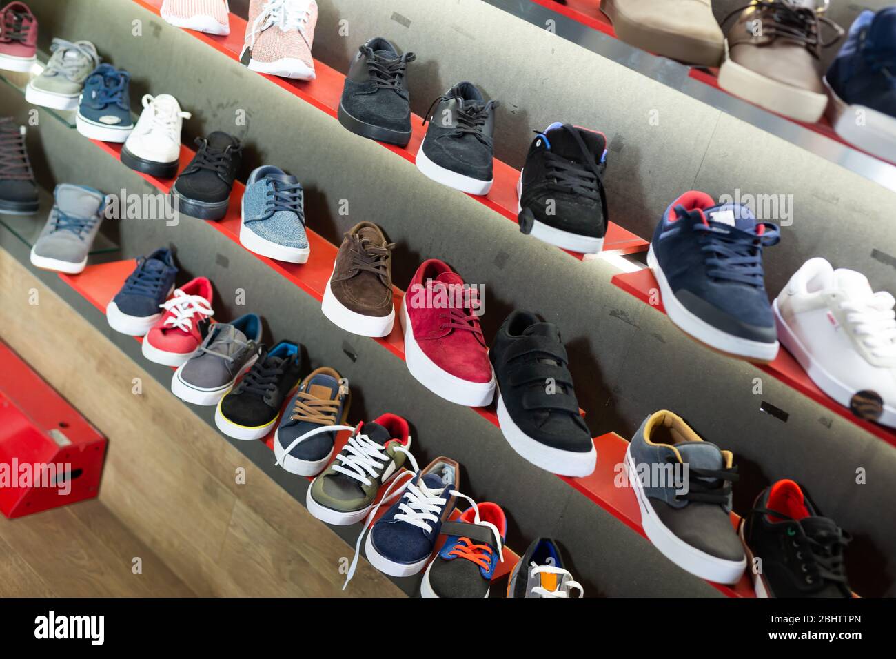 Variety of casual men shoes on shelves 