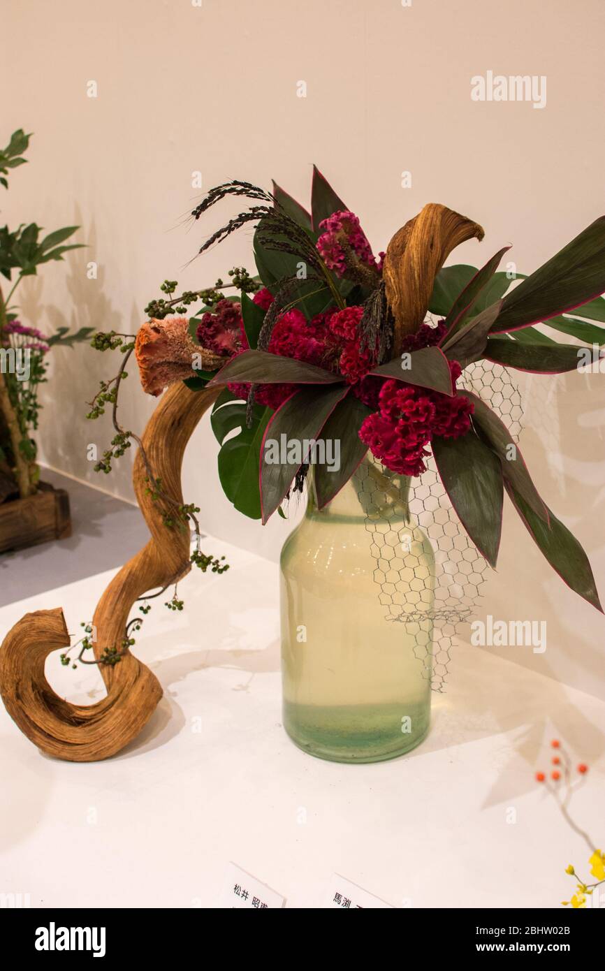 Beautiful Ikebana Japanese art of flower arrangement on white