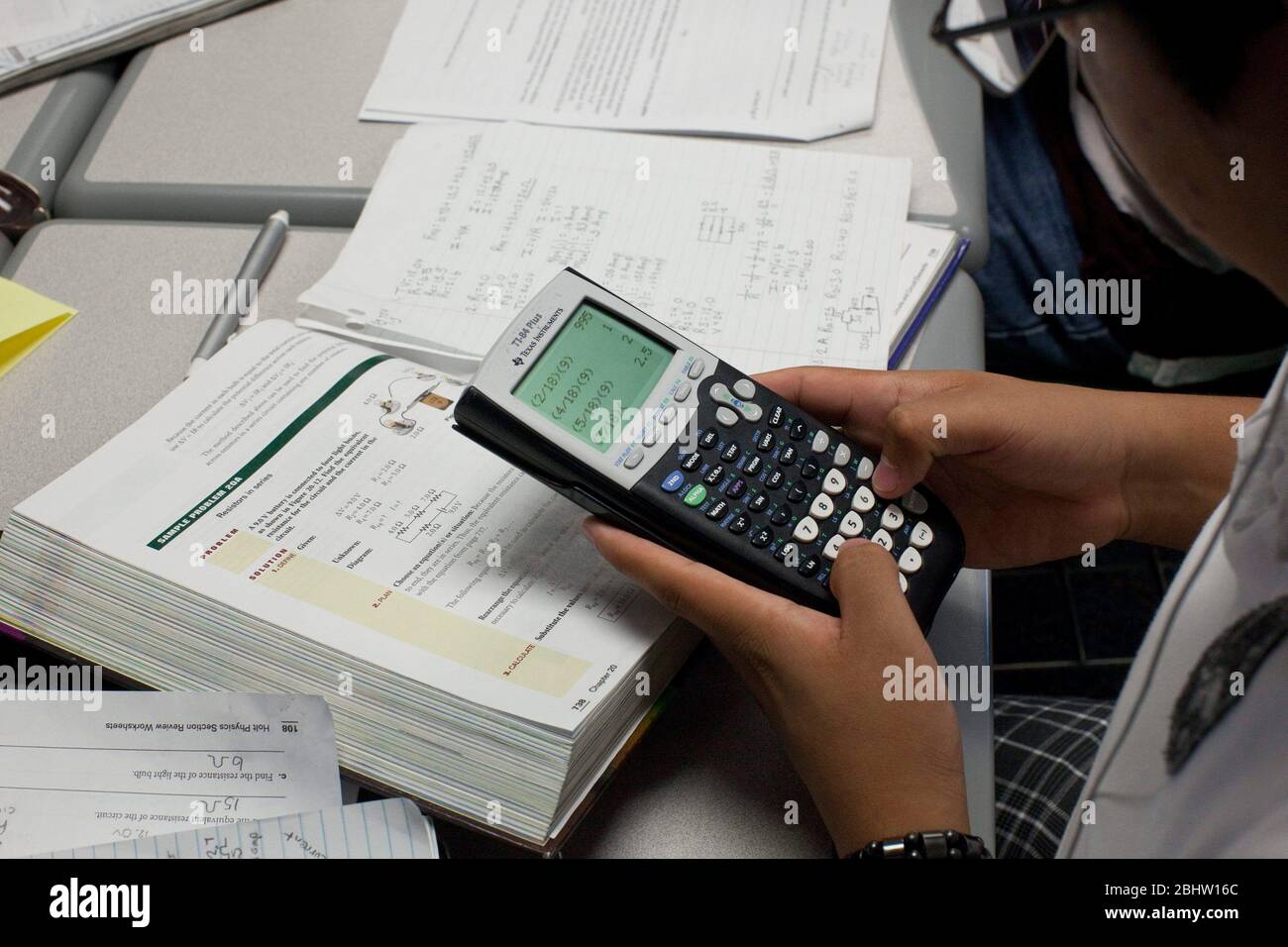 El Paso, Texas USA, May 2010: Student uses graphing calculator in math  class at Mission Early College High School. ©Bob Daemmrich Stock Photo