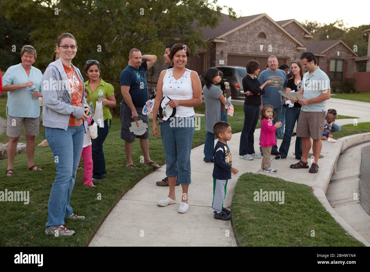 Austin Texas USA, October 5, 2010: Residents of a far south Austin neighborhood gather during National Night Out, a national anti-crime effort aimed at keeping neighborhoods vibrant and safe. Dozens of groups met throughout the city to heighten awareness of crime prevention and foster better police community relations. ©Bob Daemmrich Stock Photo