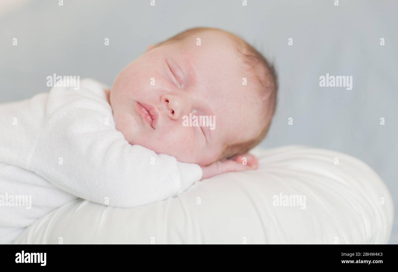newborn baby boy sleeping up close Stock Photo