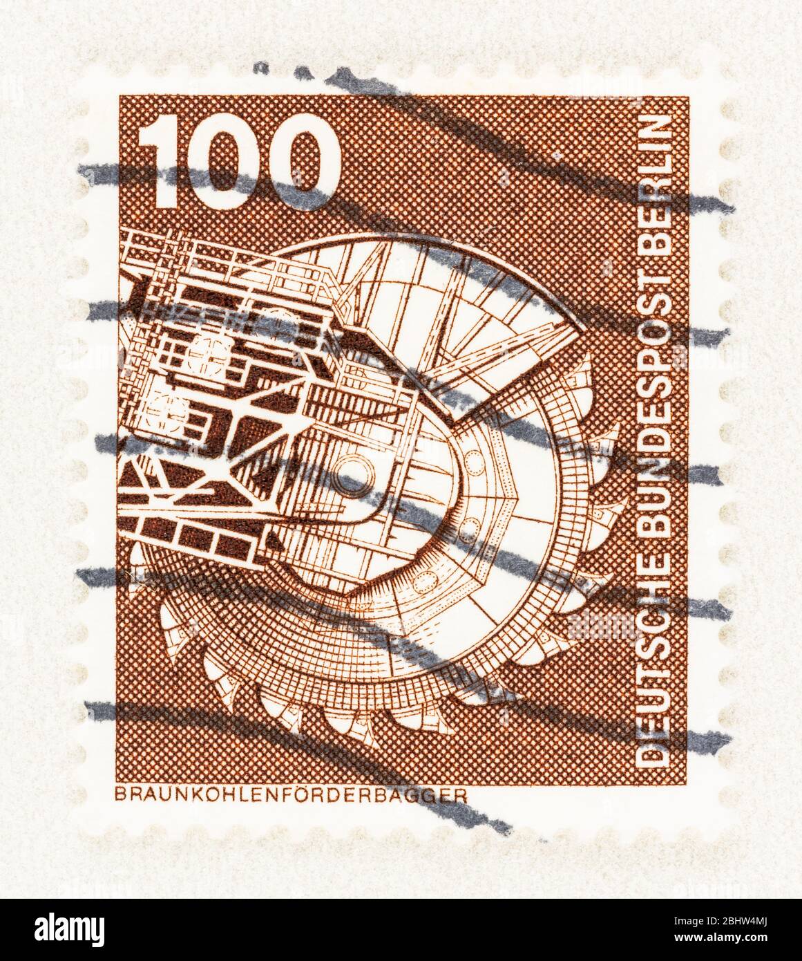 SEATTLE WASHINGTON - April 26, 2020:  Brown German stamp featuring lignite (brown coal)  excavator and conveyor, issued as part of the Industry and Te Stock Photo