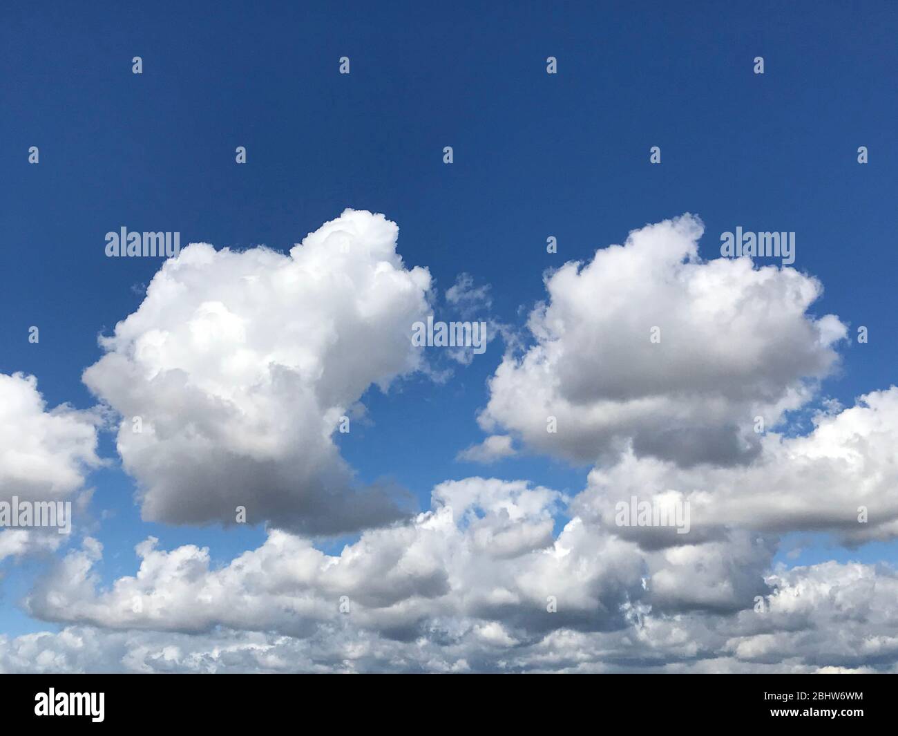 Puffy clouds in clear sky over Los Angeles, CA Stock Photo
