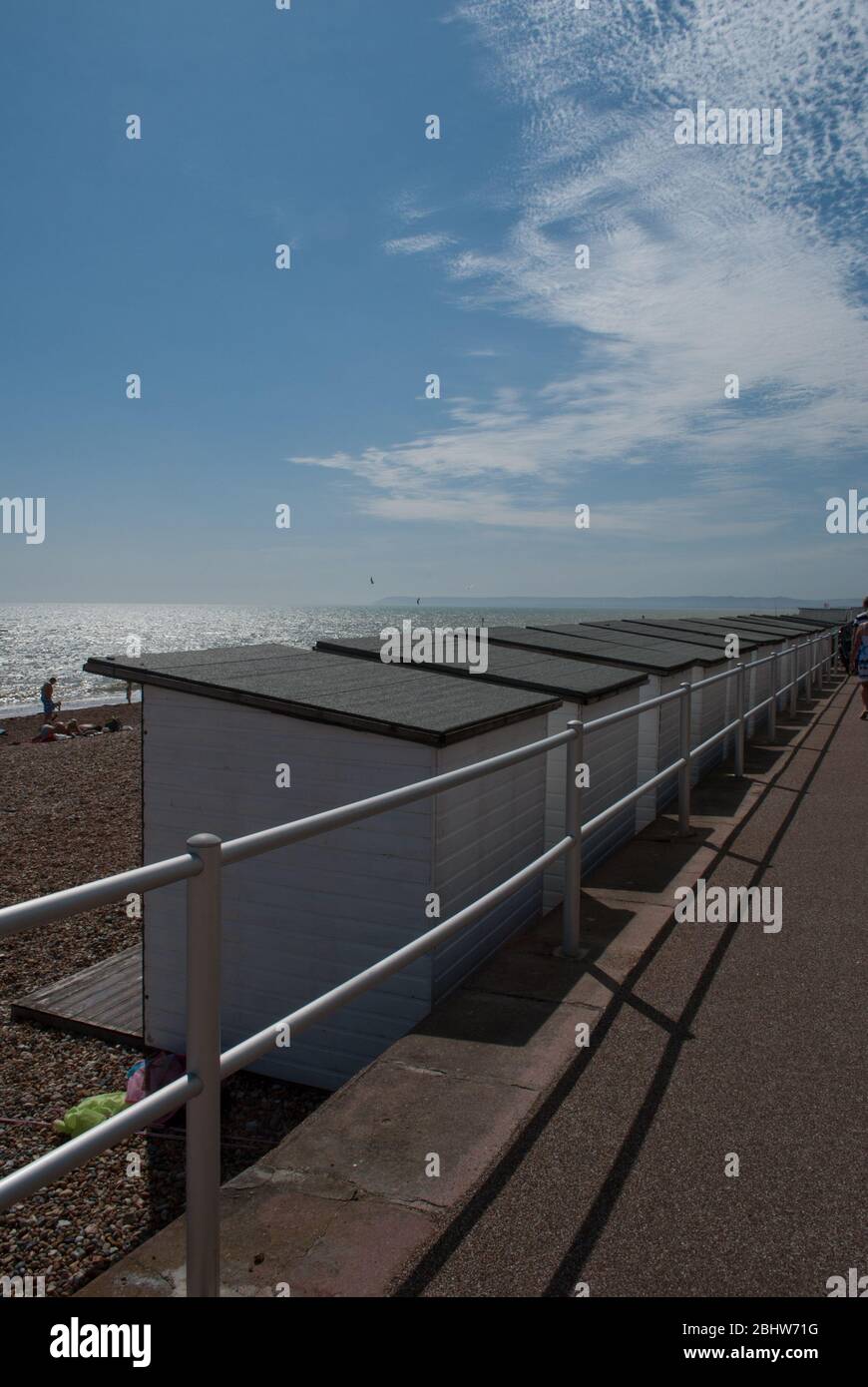 Beach huts along the sea front in Bexhill Stock Photo Alamy