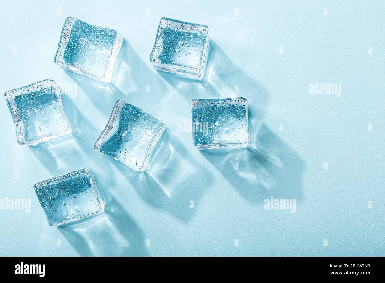 Colored banner with fresh ice cubes and reflections Stock Photo