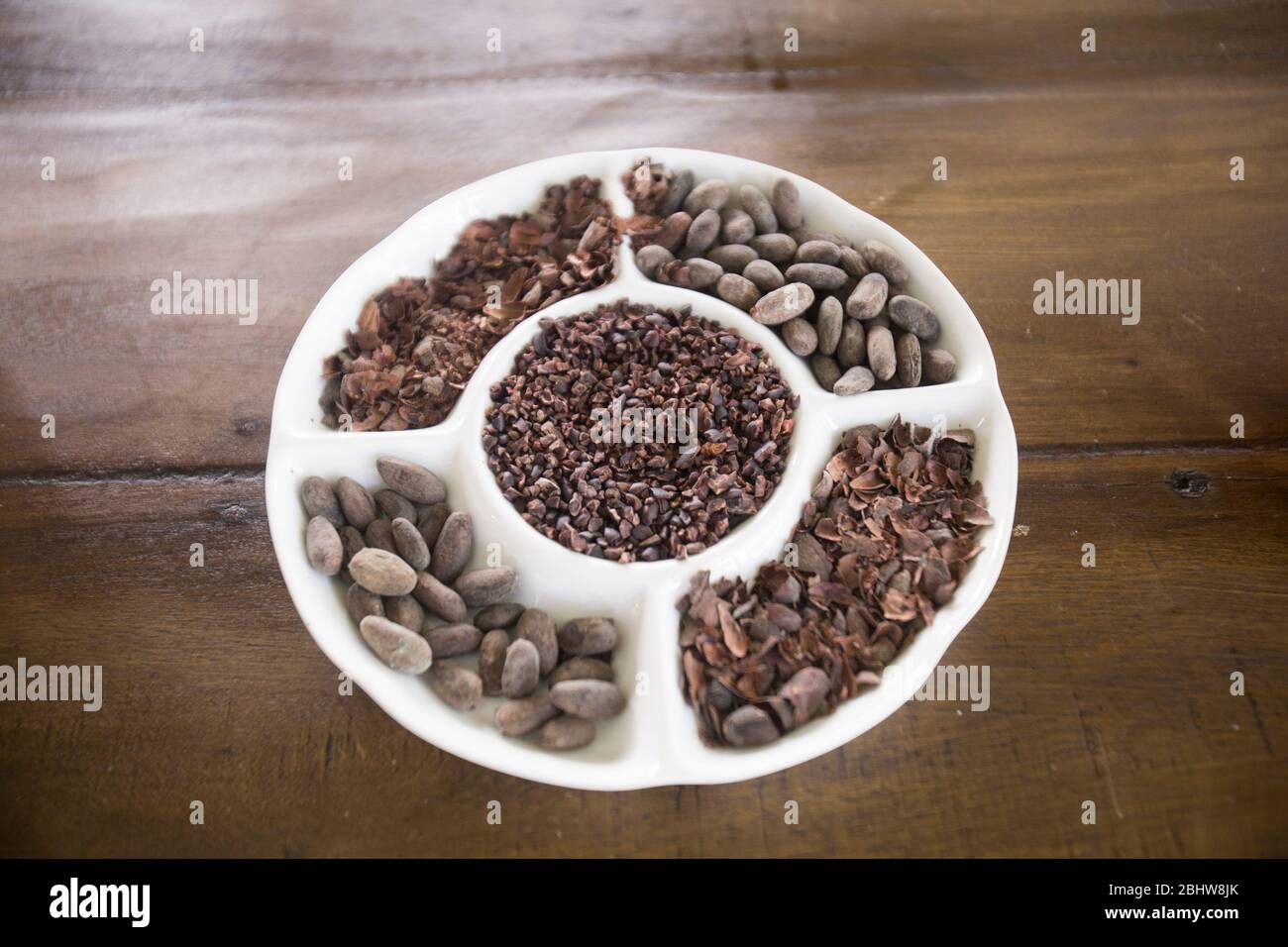 Raw Cacao Beans on a table Stock Photo