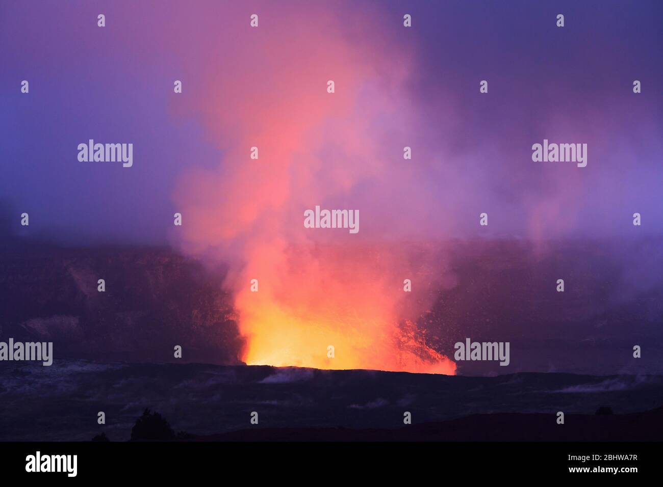 Evening glow from Hale Mahumahu caldera in Volcanoes National Park in Hawaii. Stock Photo