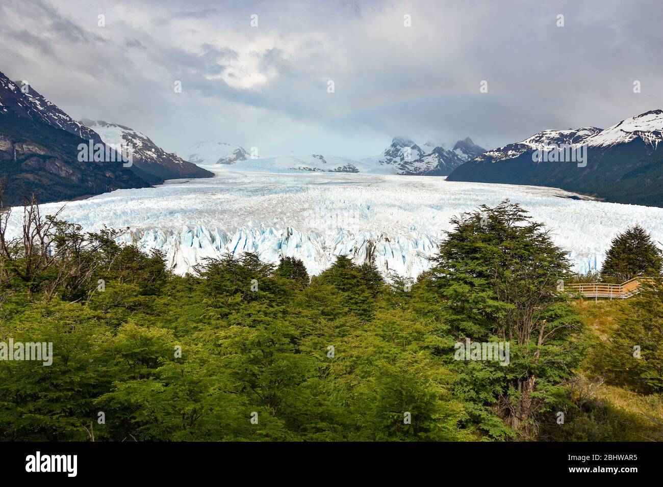 landscape with Perito Moreno glacier, andes mountains, forest and rainbow, Patagonia, Argentina Stock Photo