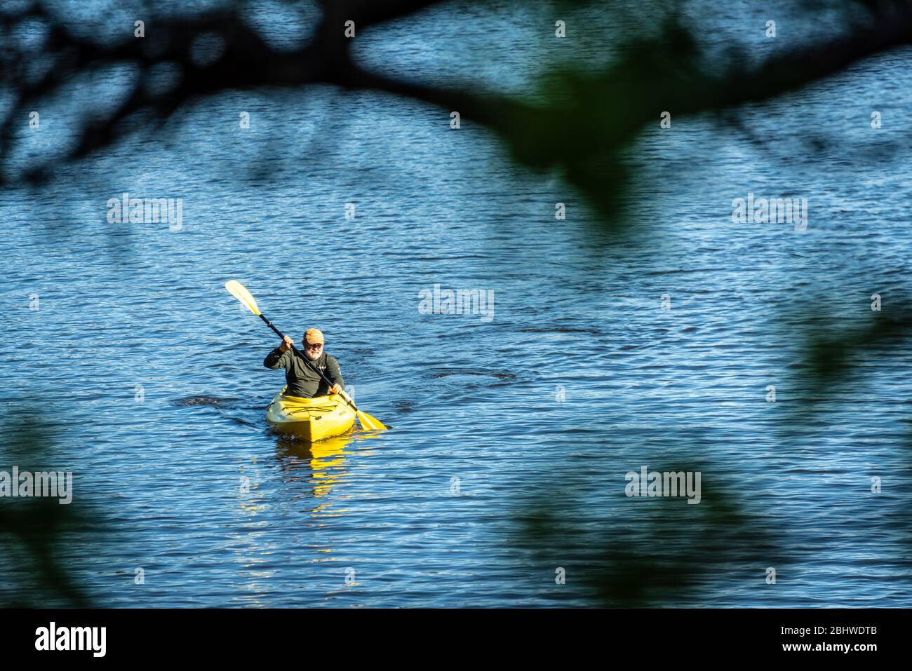 Senior kayaking on Stone Mountain Lake in Atlanta, Georgia's Stone Mountain Park. (USA) Stock Photo