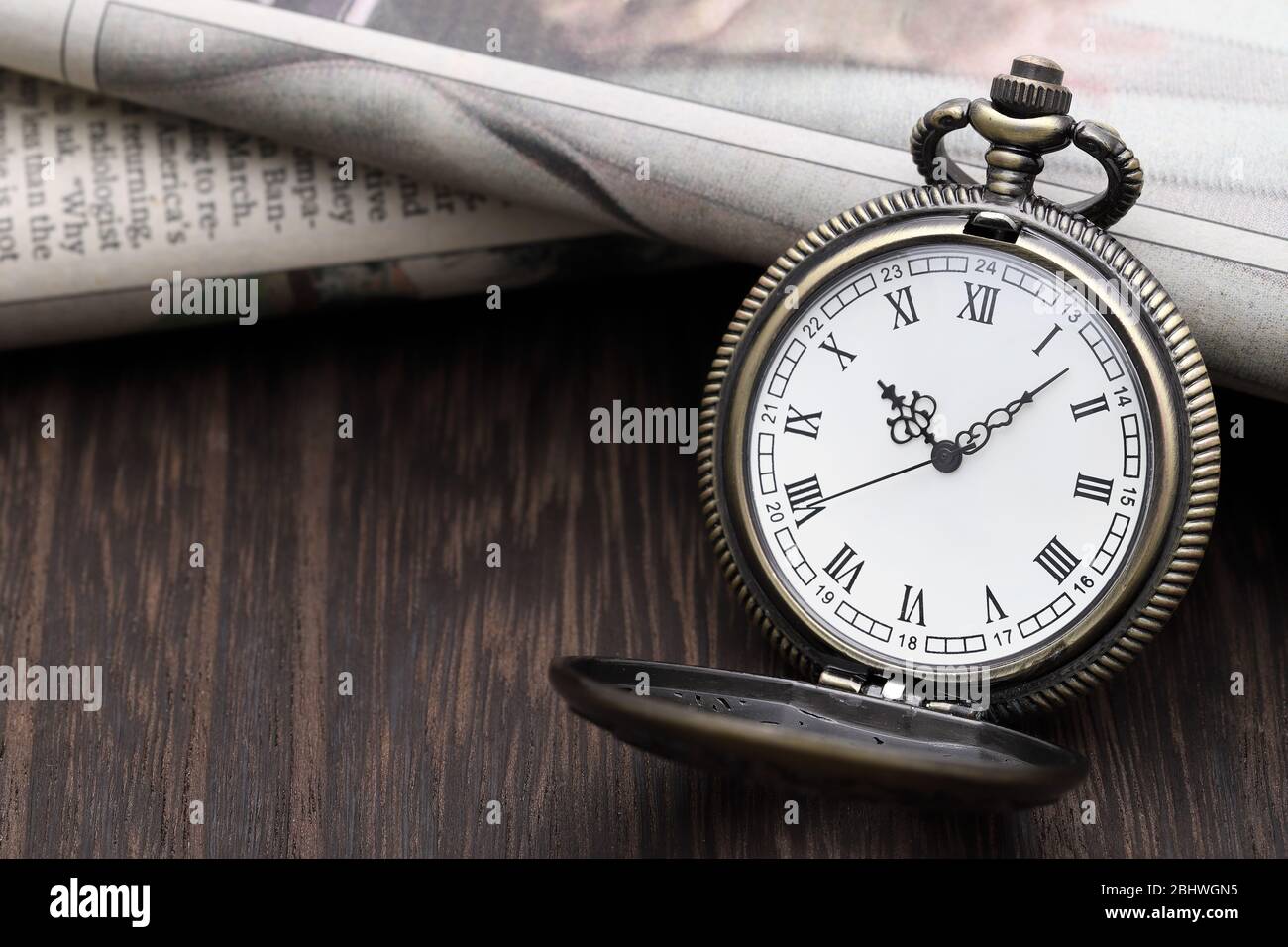 Old Pocket Watch And Newspaper On Dark Wooden Table Stock Photo Alamy