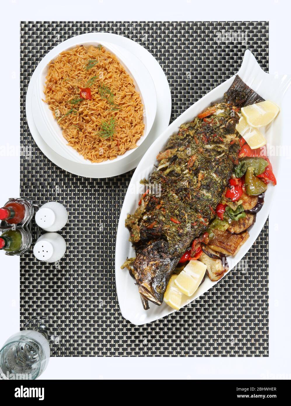 Grilles sea bass fish with fish kabsa rice Stock Photo Alamy