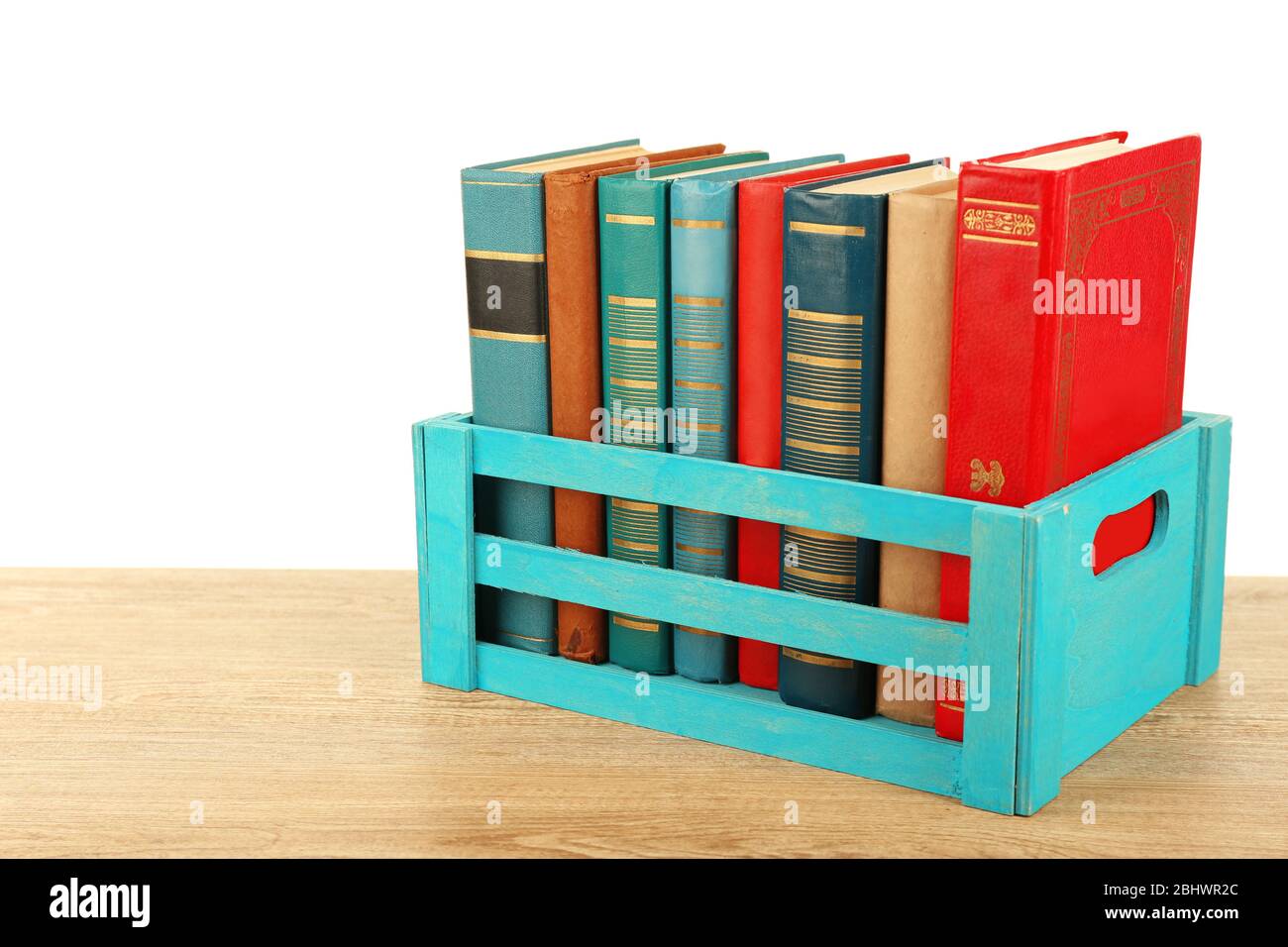 Books in wooden box isolated on white Stock Photo