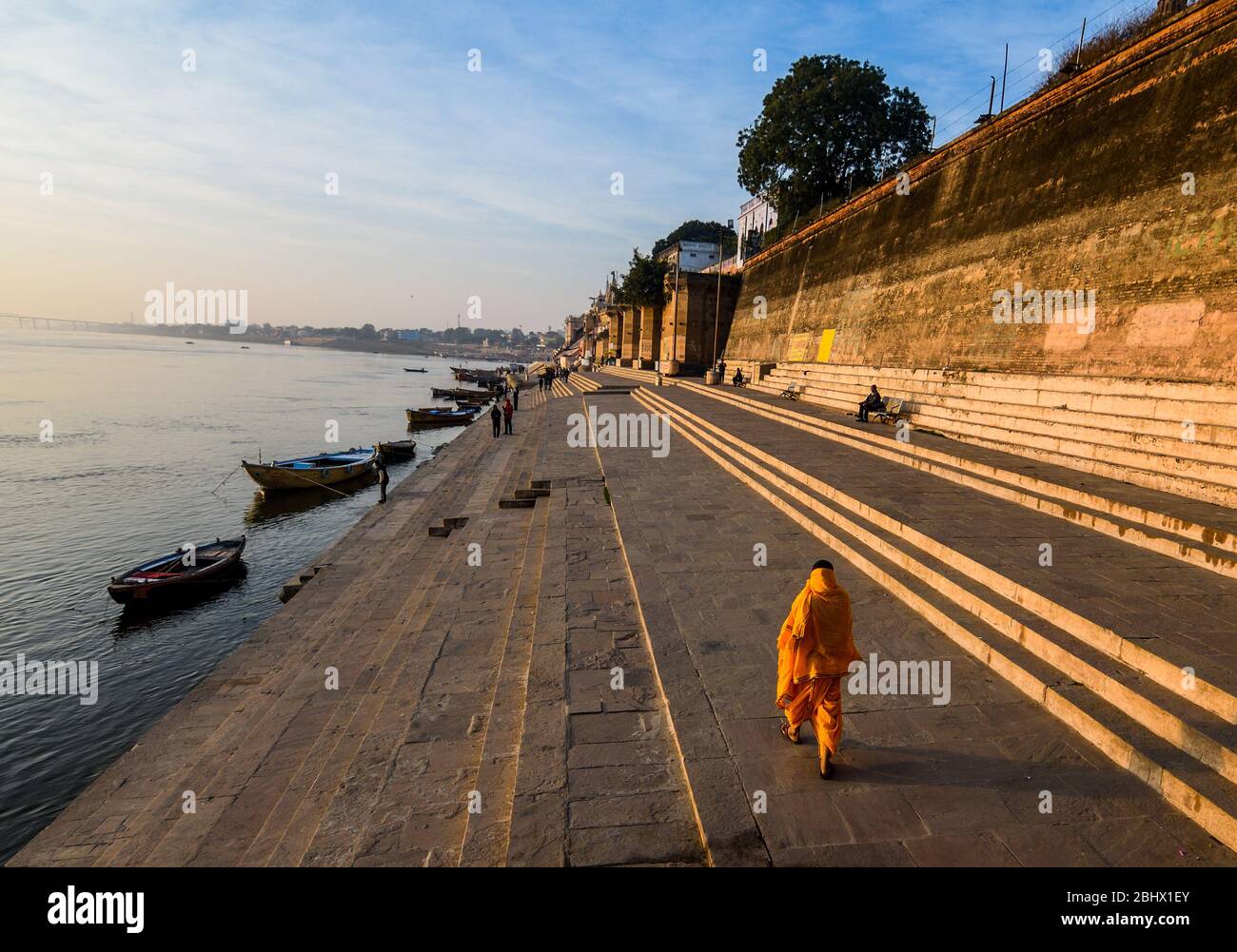Man walking on the ghat of the holy city of Varanasi, Uttar Pradesh, India. Stock Photo