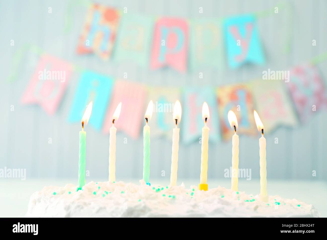 Birthday cake with candles on planks wall background Stock Photo - Alamy