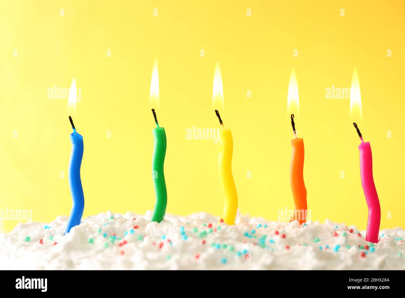 Birthday cake with candles on color background Stock Photo - Alamy