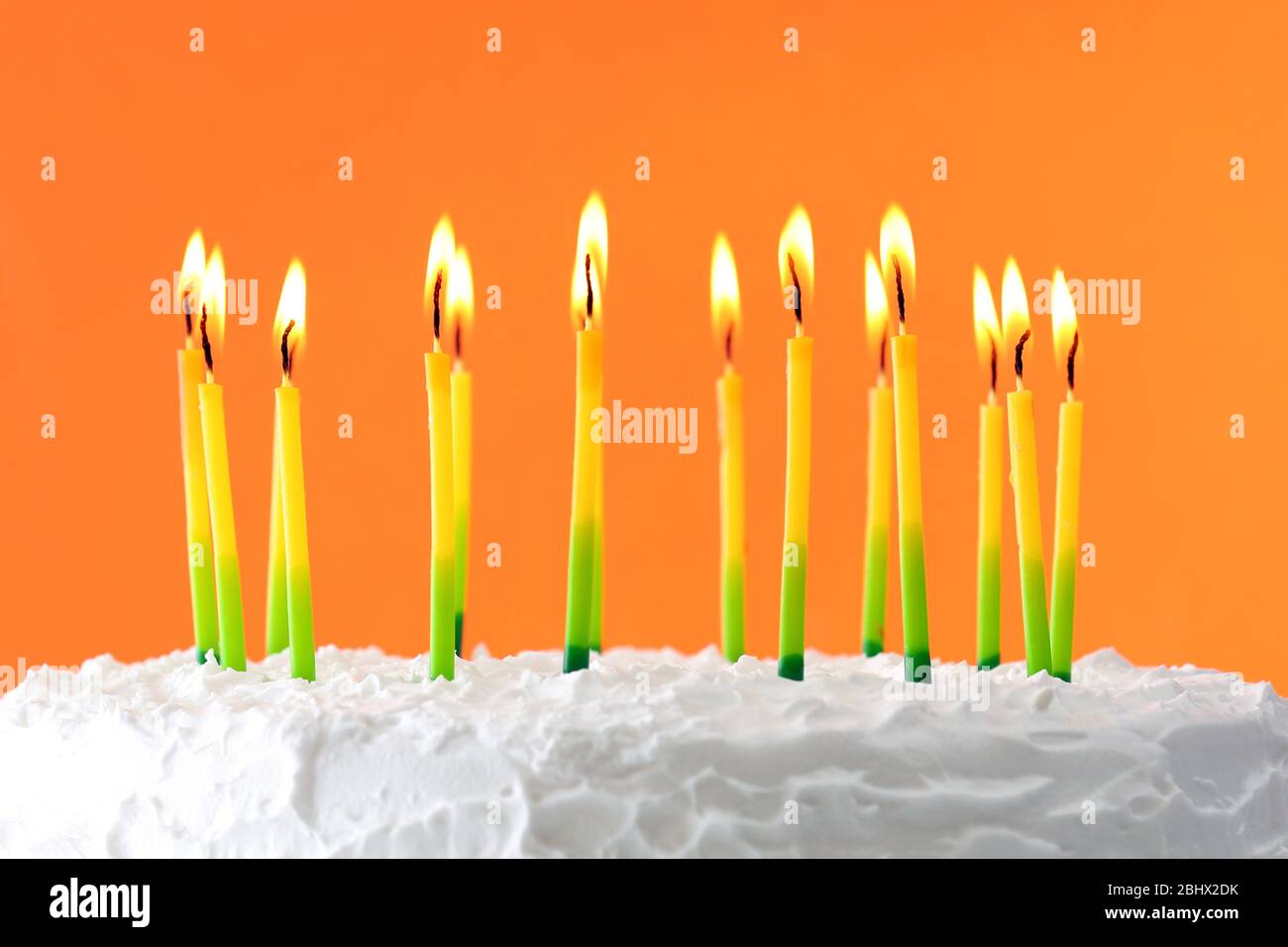 Birthday cake with candles on color background Stock Photo - Alamy