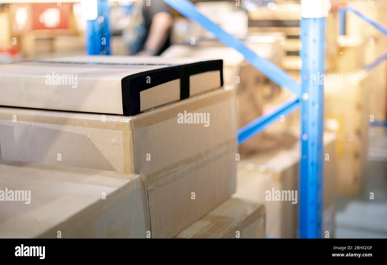 A pile of cardboard box parcel prepare to put on the shelf or blue