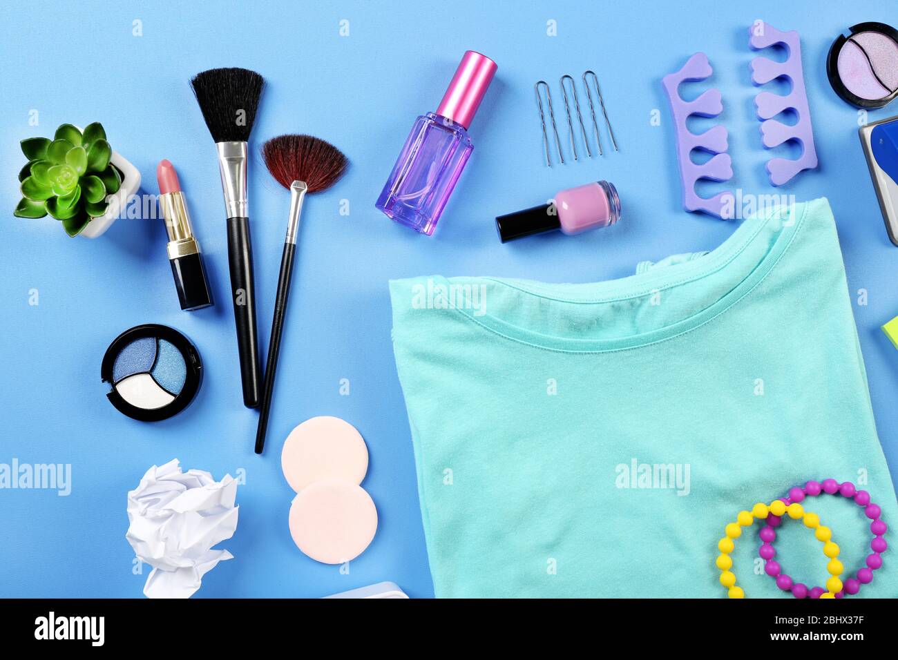 Modern female clothing and accessories on color background Stock Photo ...