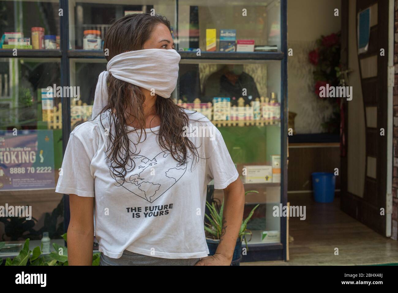 American tourist standing outside a pharmacy during the Covid-19 lockdown in India. Stock Photo