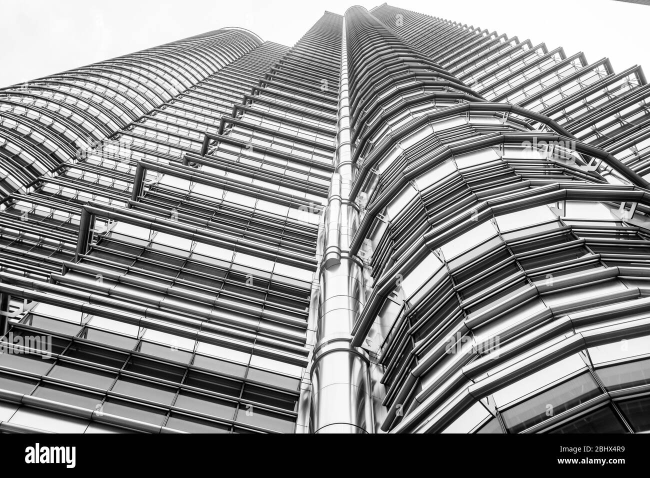 Kuala Lumpur Malaysia - October 9 2013; Petronas twin tower building international landmark rising from street exterior of architectural detail of Pet Stock Photo