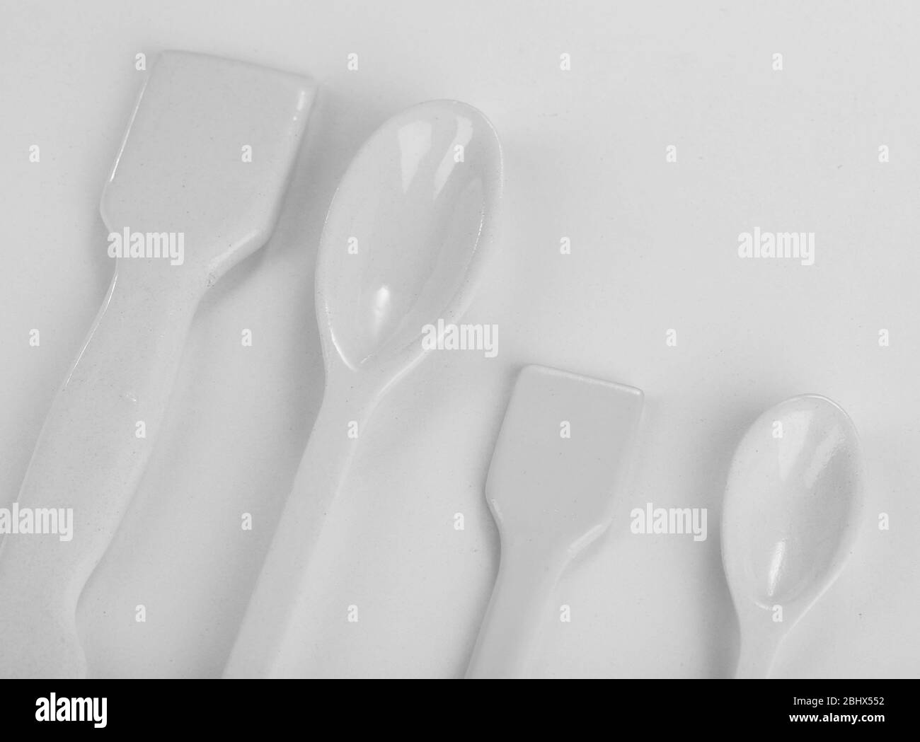 Laboratory spatulas isolated on white Stock Photo Alamy