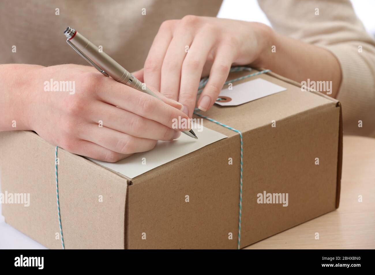 Woman Signs Parcel In Post Office Stock Photo Alamy woman-signs-parcel-in-post-office-stock-photo-alamy