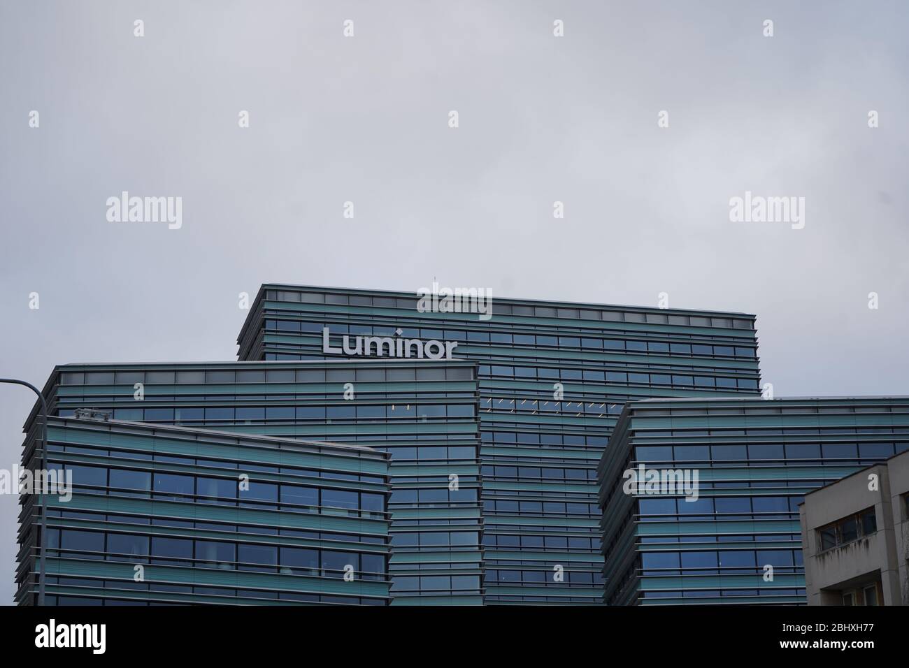 Modern office building with cloudy sky Stock Photo - Alamy