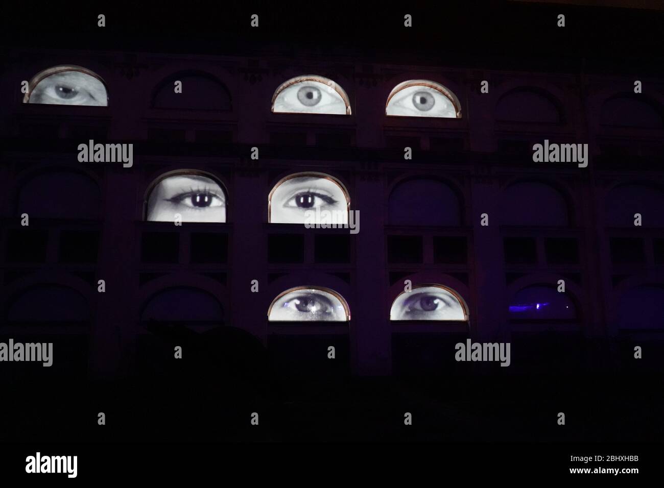 Scary house with many eyes in the night Stock Photo