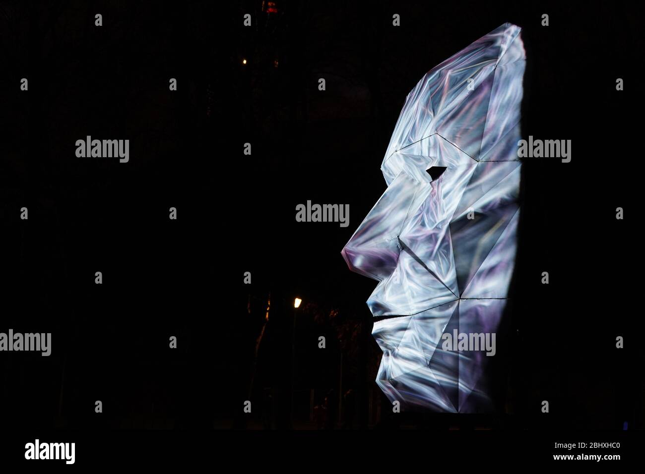 Face projected on the real white face sculpture Stock Photo