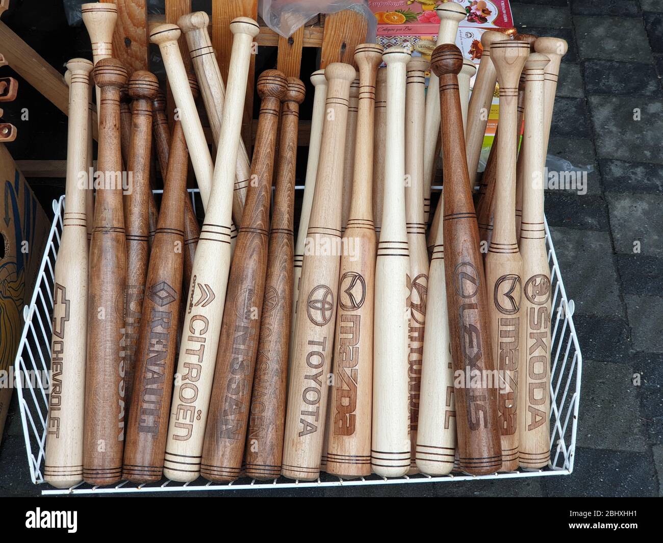 Baseball bats with various car manufacturer logos Stock Photo - Alamy