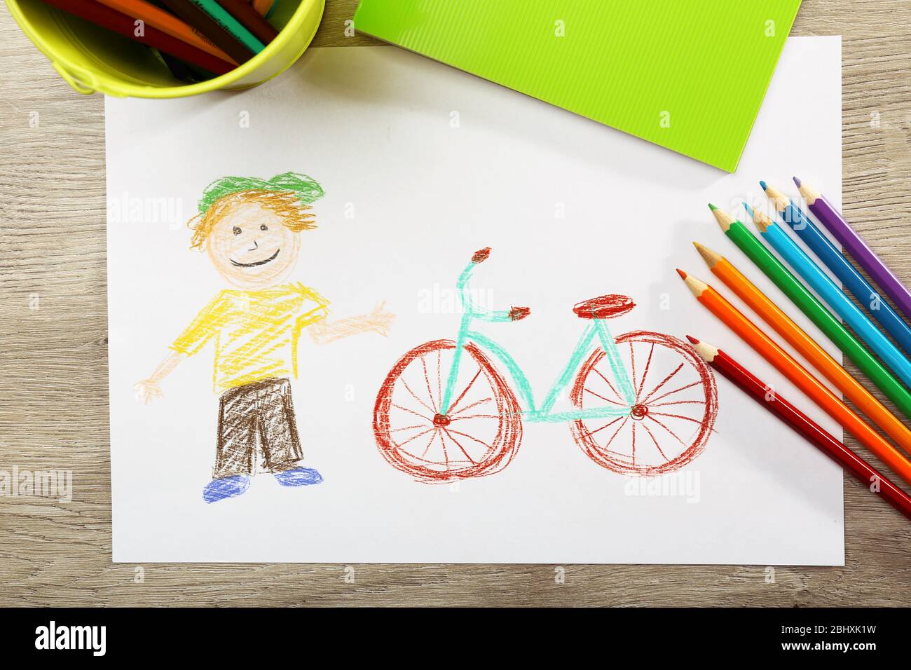 Kids Drawing On White Sheet Of Paper Background Stock Photo