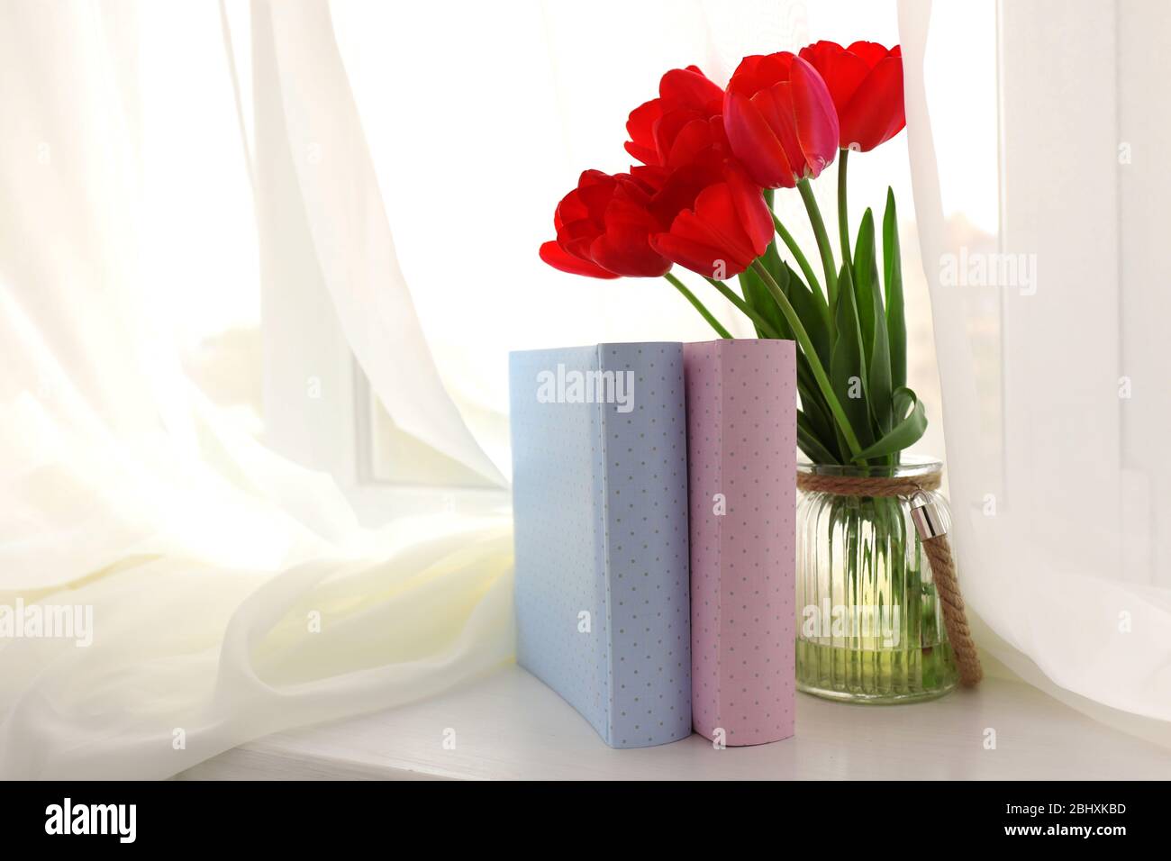 Still life with bouquet of fresh tulips on windowsill background Stock ...