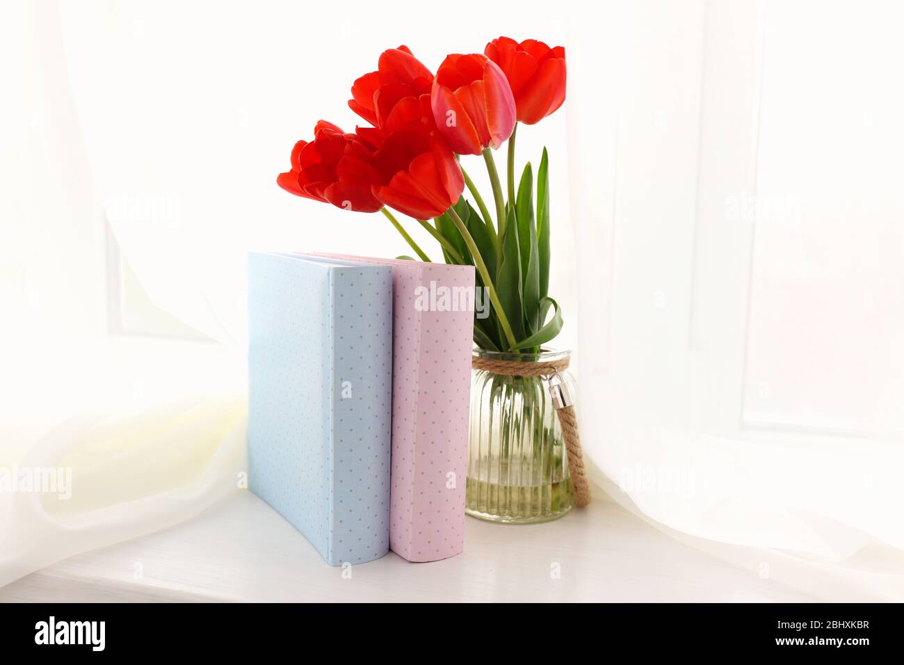 Still life with bouquet of fresh tulips on windowsill background Stock ...