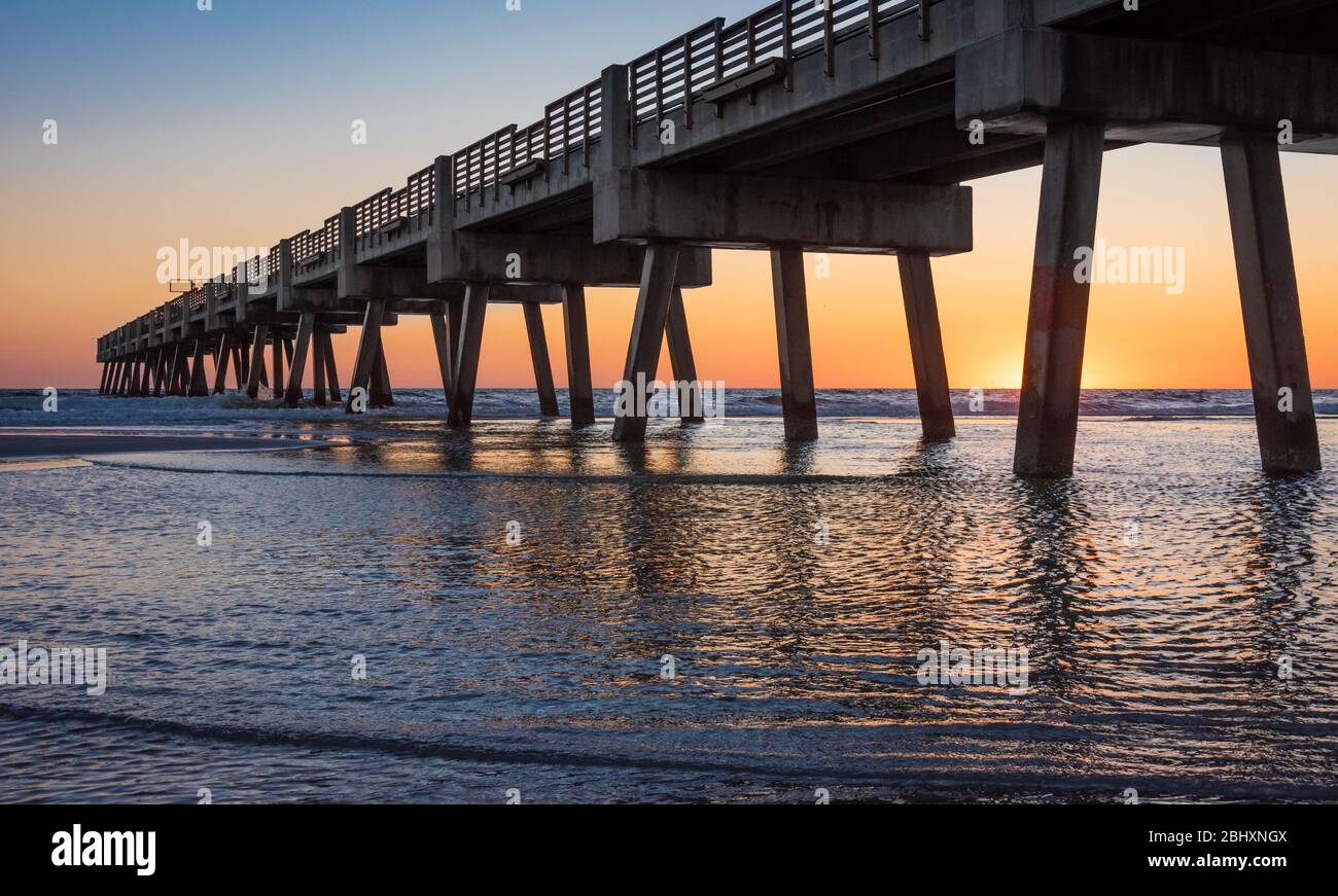 Colorful sunrise at Jacksonville Beach Pier in Jacksonville Beach, Florida. (USA) Stock Photo