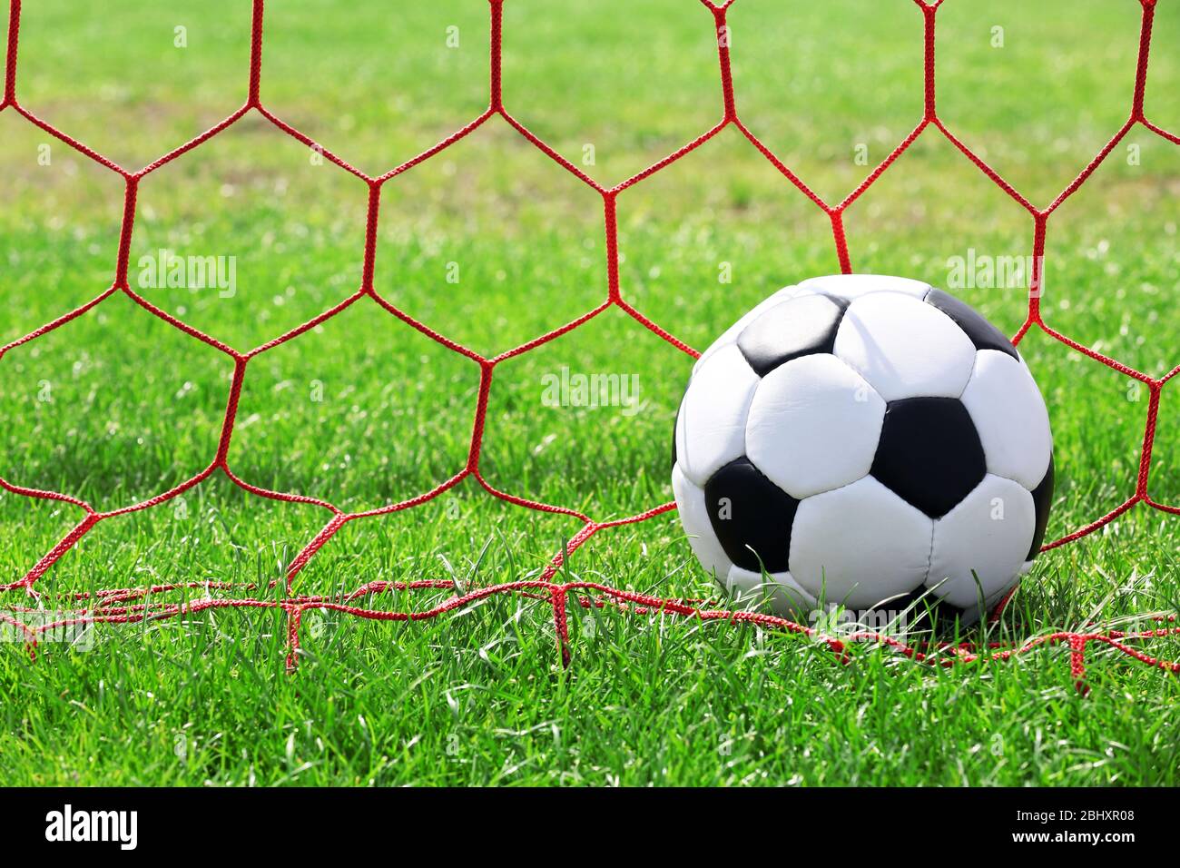 soccer ball in goal Stock Photo - Alamy