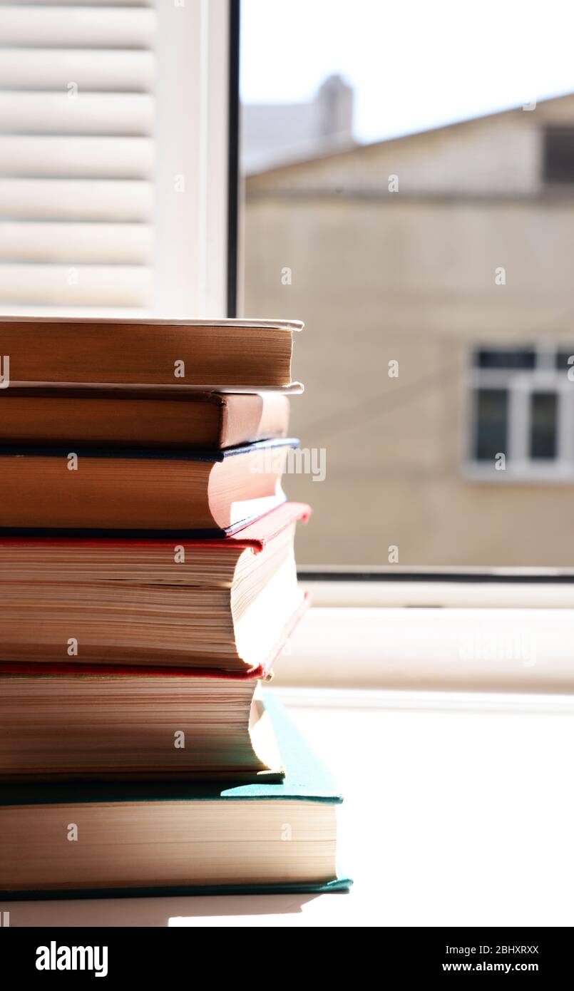 Stack Of Books On Windowsill Stock Photo - Alamy