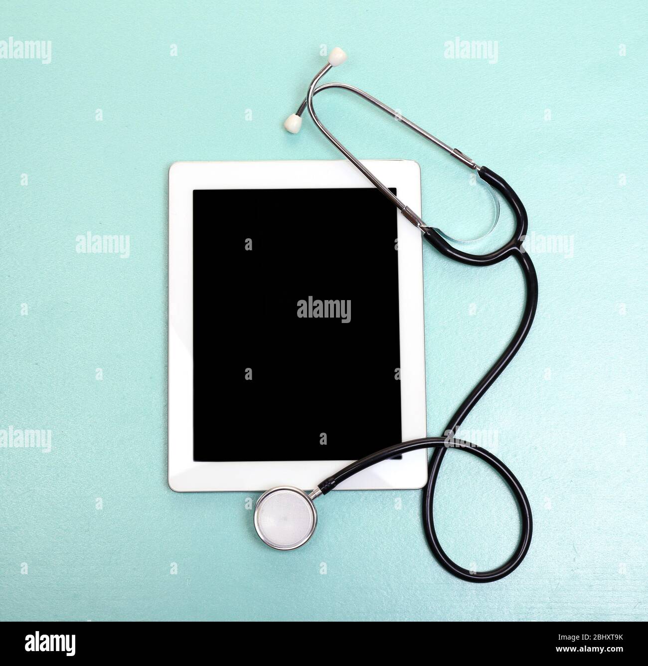 Medical tablet with stethoscope on light background Stock Photo - Alamy