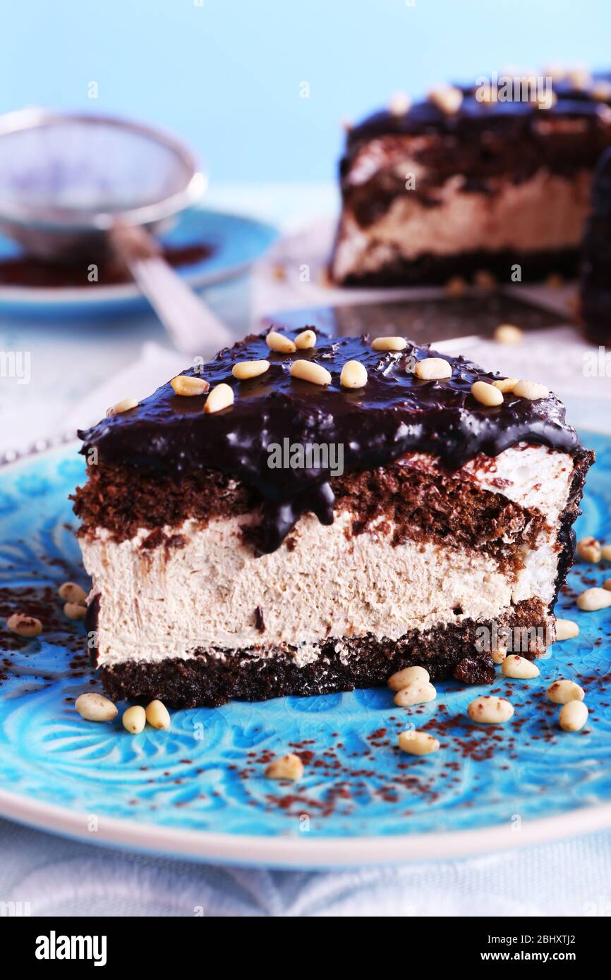 Delicious chocolate cake with icing in plate on table, closeup Stock ...