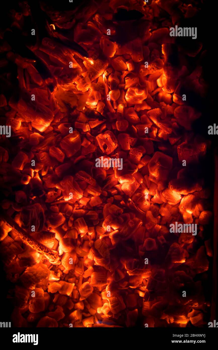 BBQ Grill Pit With Glowing And Flaming Hot Charcoal Briquettes, Food