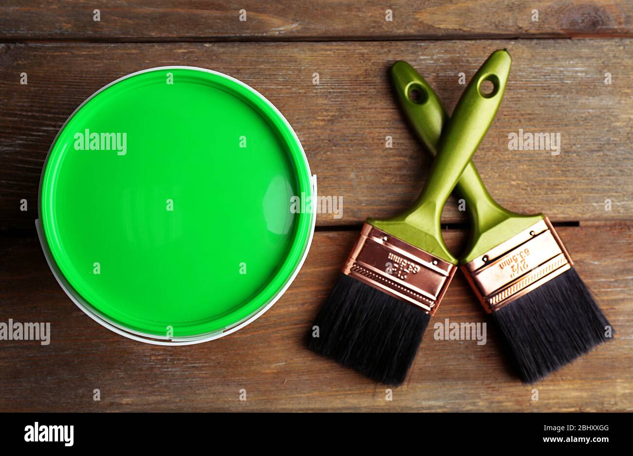 Paint can and paint brushes on wooden background Stock Photo - Alamy